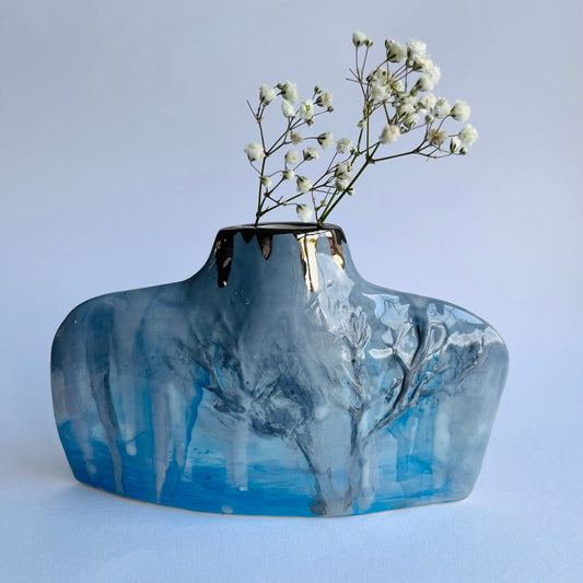 Blue & Grey Silhouette Porcelain Winter Trees Bottle Vase with gypsophila flowers inside