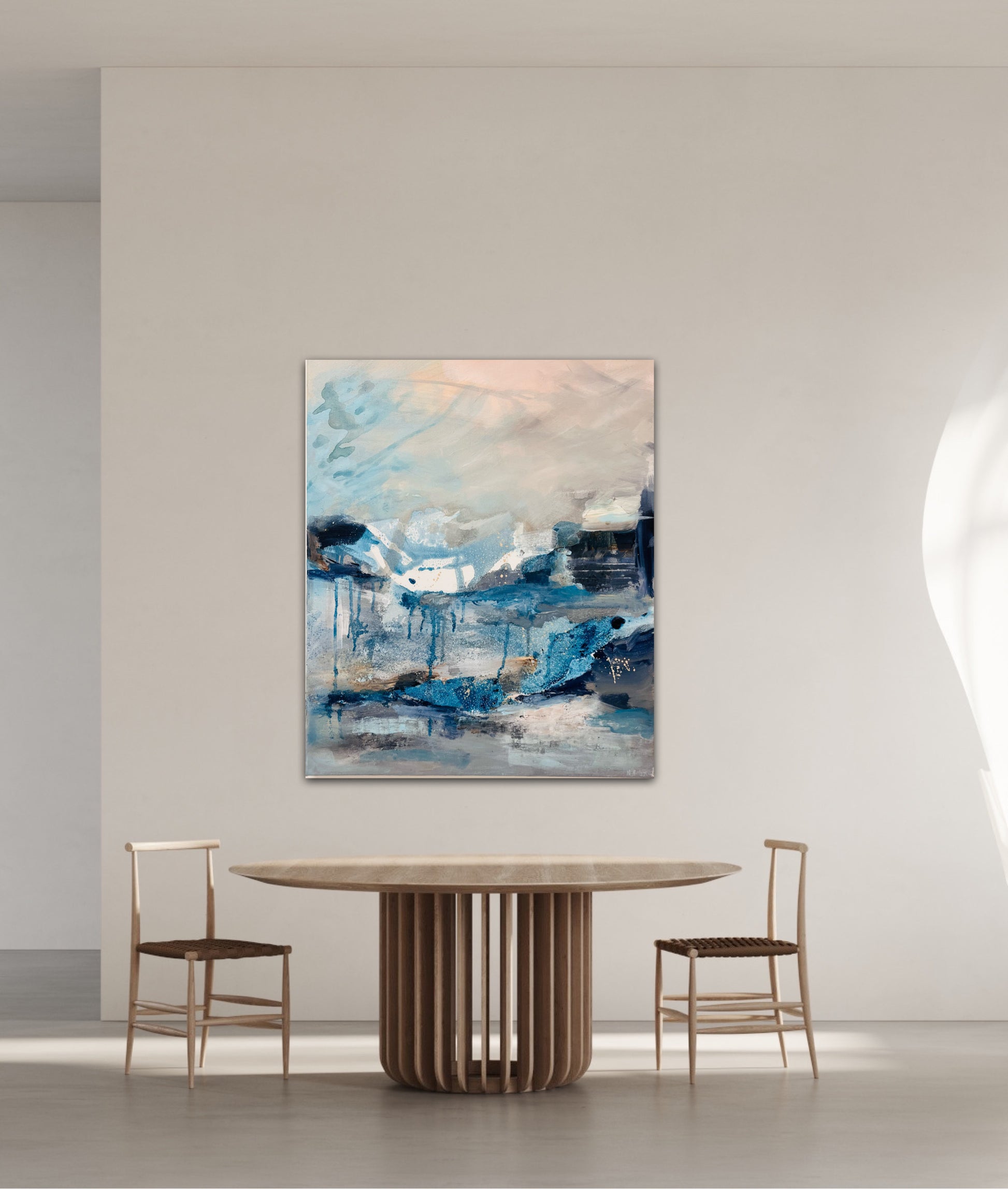 In the Still Air blue expressive painting lifestyle photo above modern wooden dining table and two chairs