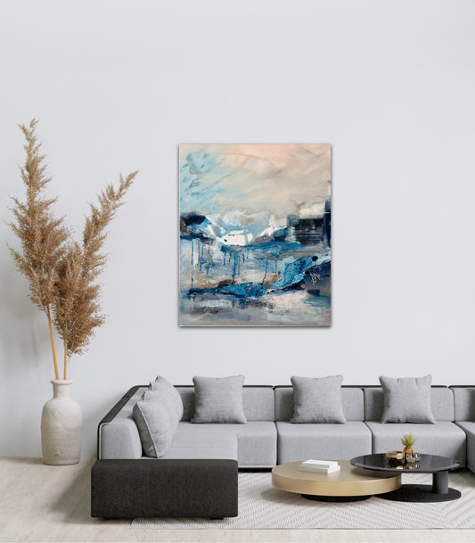 Lifestyle photo of the expressive artwork painted by Nicola briggs hanging on a white wall in a styled living room with a modern minimalist grey couch