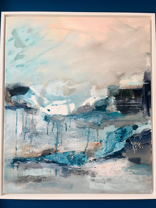 Abstract acrylic painting with texture in blue, peach and white tones in a frame.