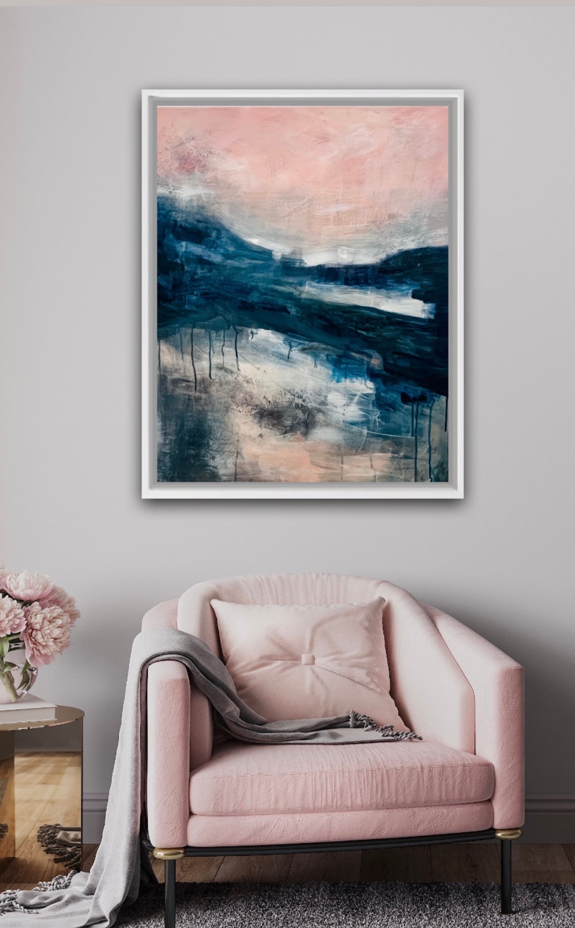 Pink armchair with a abstract landscape painting on the wall