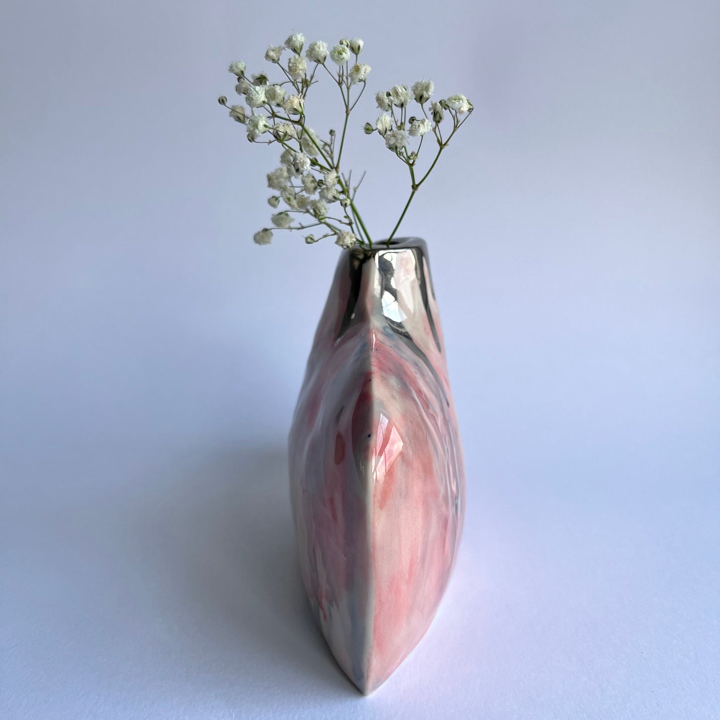 Pink Silhouette handmade porcelain bottle vase side profile photo with gypsophila inside