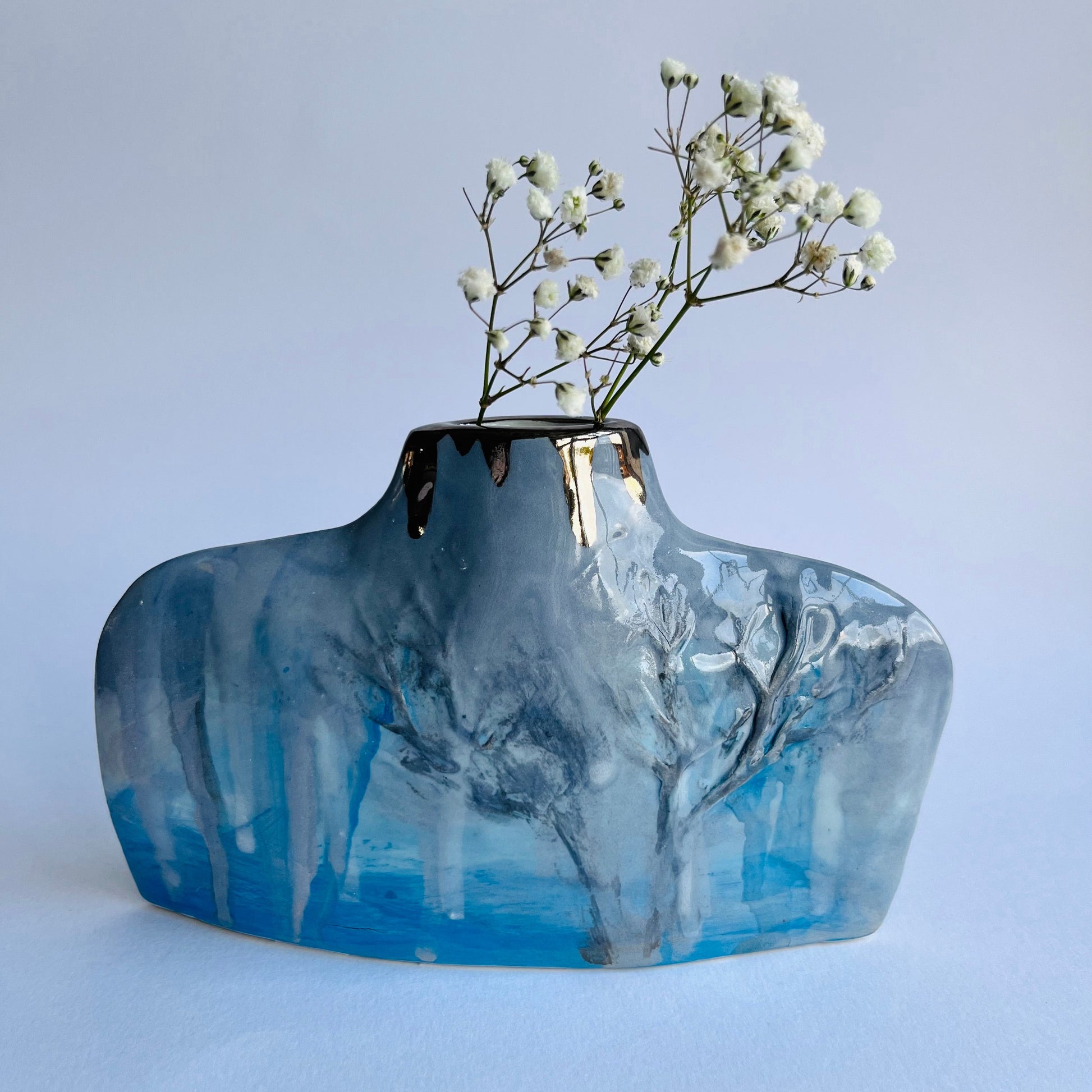Blue & Grey Silhouette Porcelain Winter Trees Bottle Vase with gypsophila flowers inside 