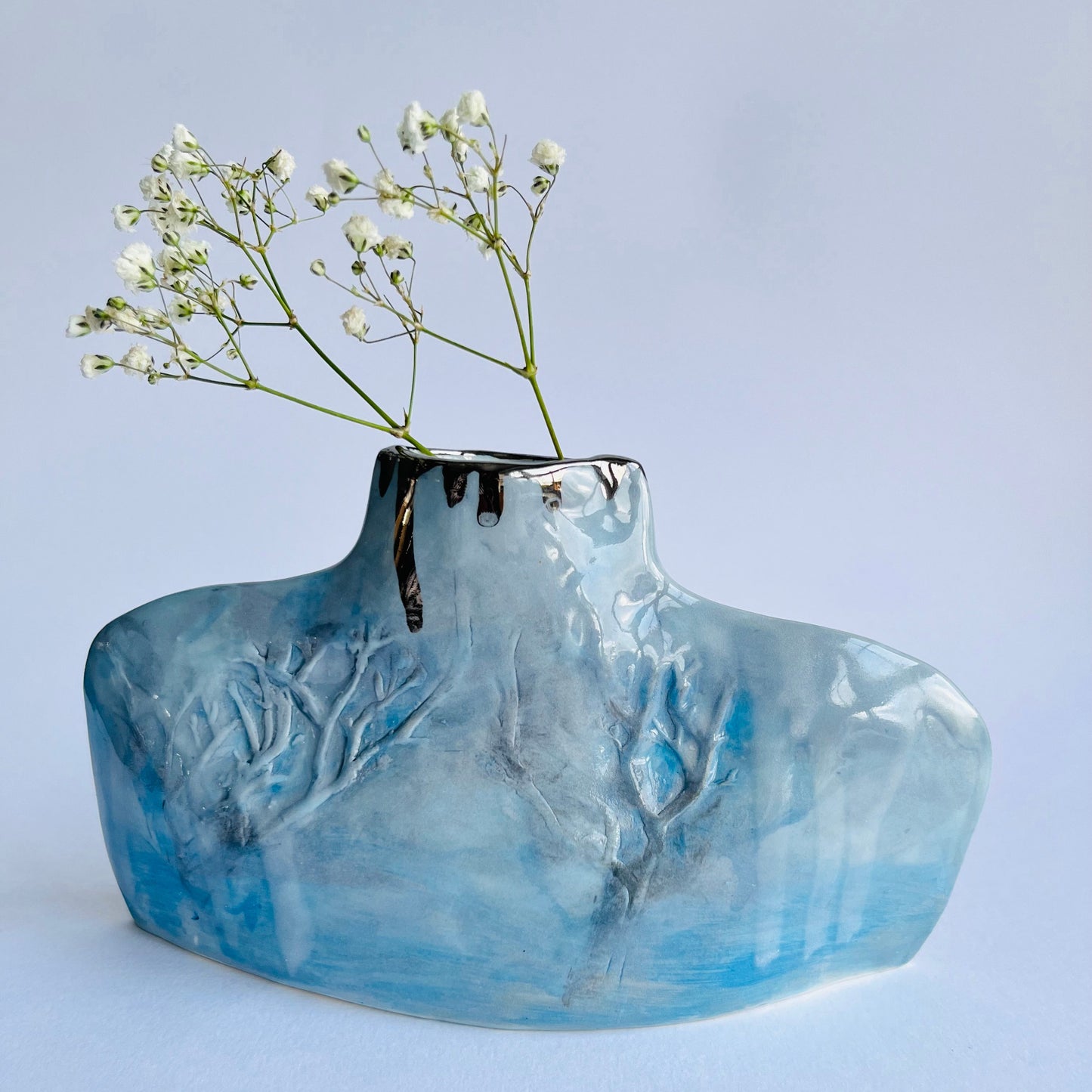 Blue & Grey Porcelain Silhouette Winter Trees Bottle Vase with gypsophila flowers inside