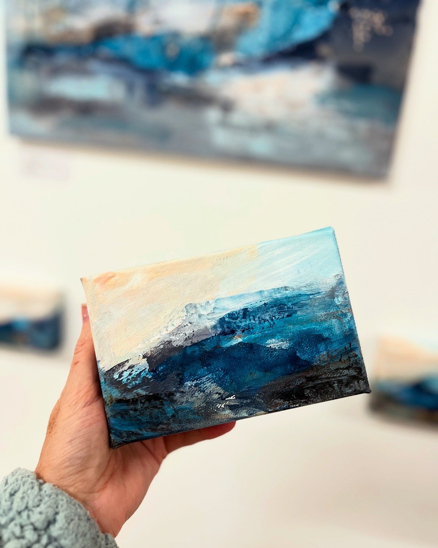 Fragments of Calm III small landscape painting by British contemporary Landscape artist Nicola Briggs photo shows box canvas held in hand for size