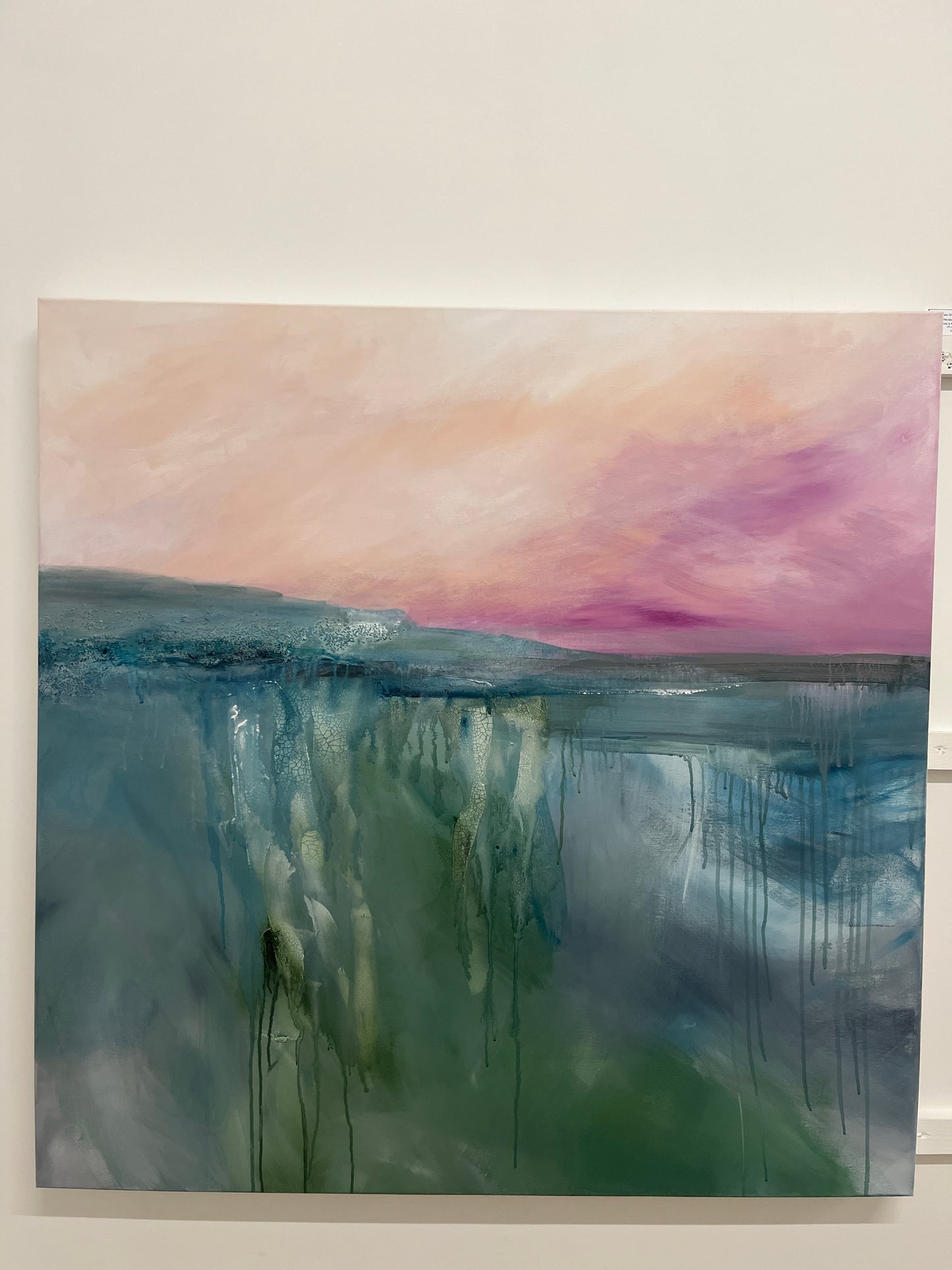 Abstract painting with pastel colors on a white wall