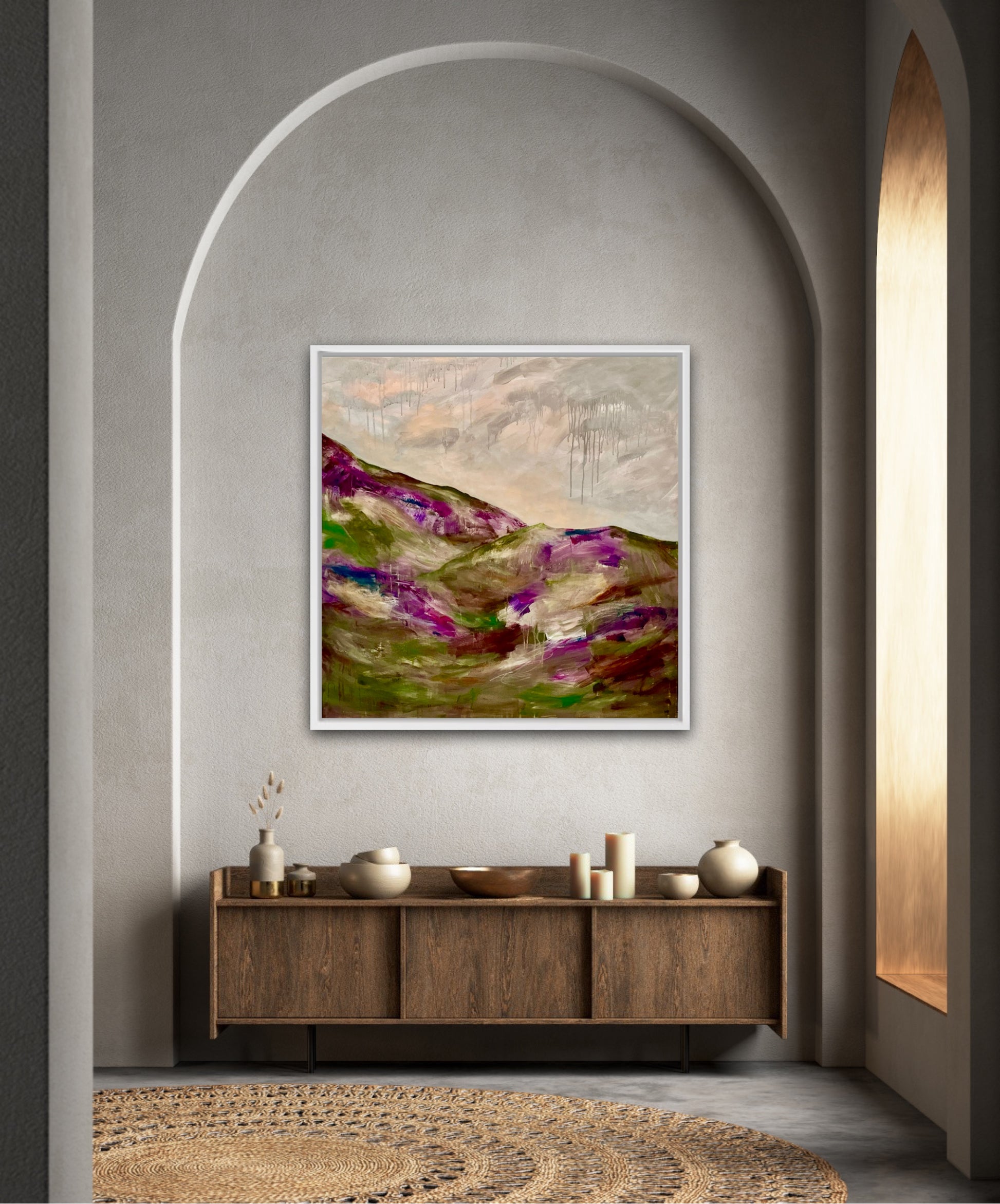 This statement artwork by Nicola Briggs conveys a sense of place that is tranquil and calm, showing the clouds and peach skies and the purple hues from the heather on the hillside.100cmx 100cm 