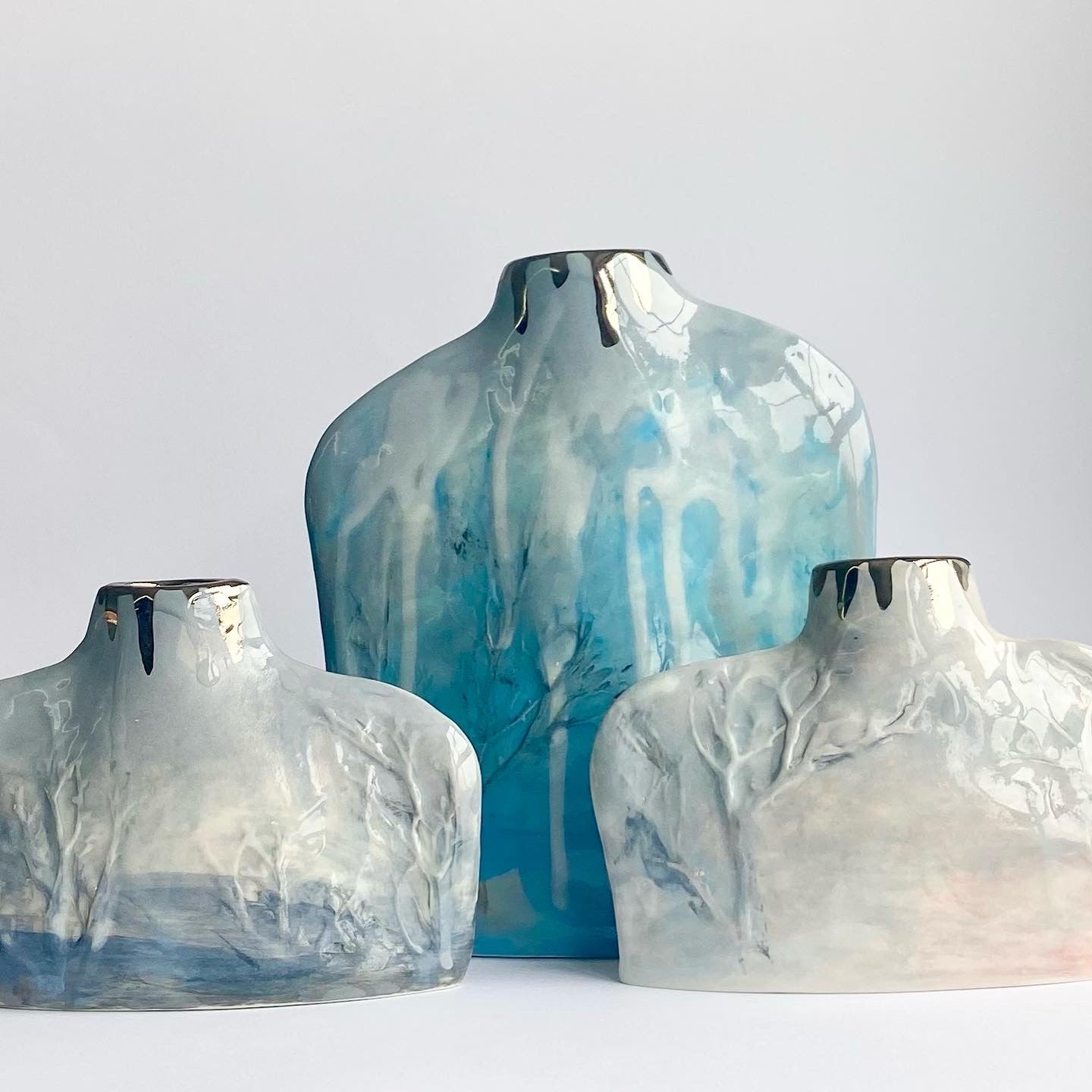 Silhouette vase collection of 3 handbuilt vases with relief winter tree design  by Nicola Briggs 