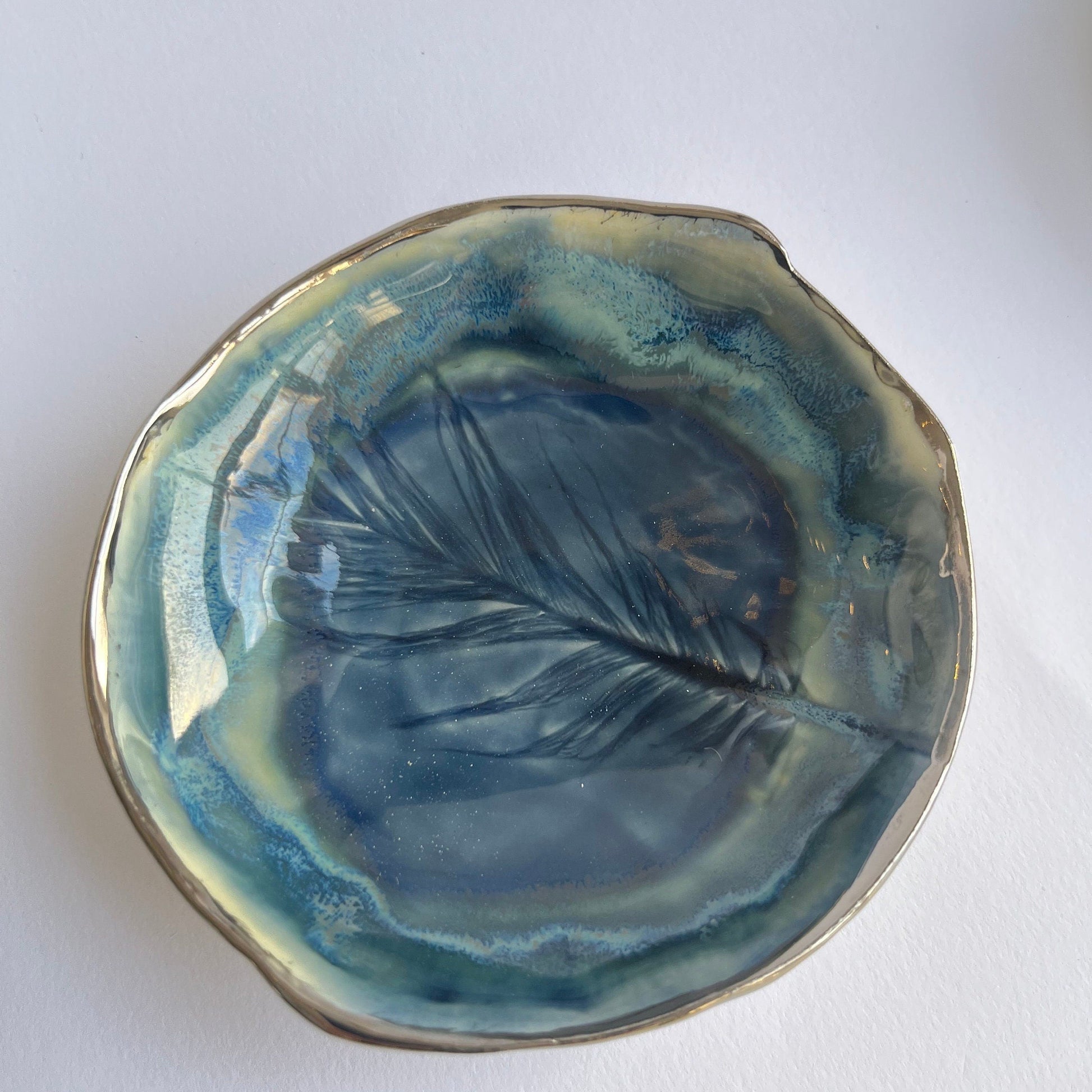 Blue glazed porcelain feather ring dish with platinum lustre rim by Nicola Briggs Ceramics 